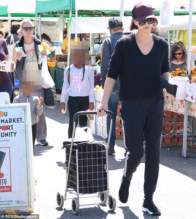 Charlize shopping in Los Angeles with seven-year-old Jackson and three-year-old August