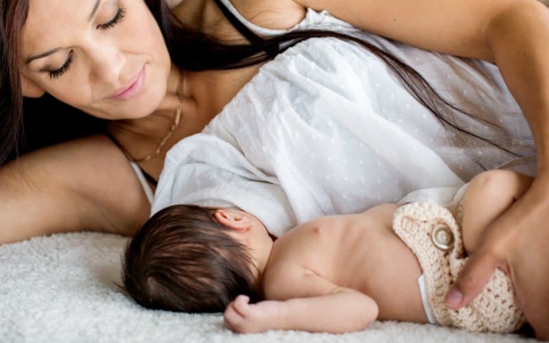 mother breastfeeding newborn baby