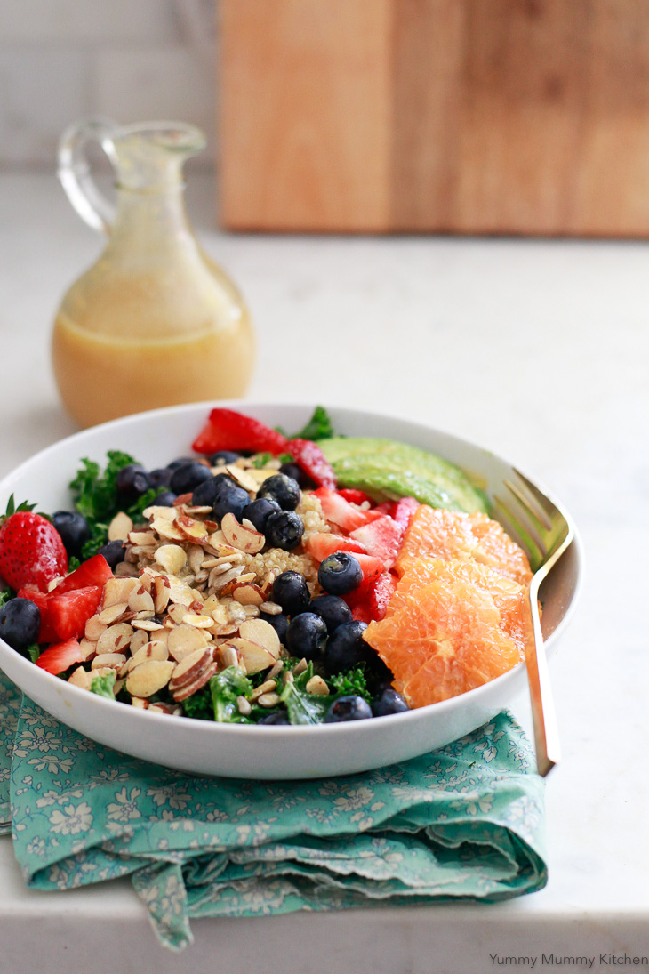 Sweet and tangy fresh orange vinaigrette is used for this superfood salad with kale, quinoa, berries, and oranges. This makes a great vegan and vegetarian lunch idea.